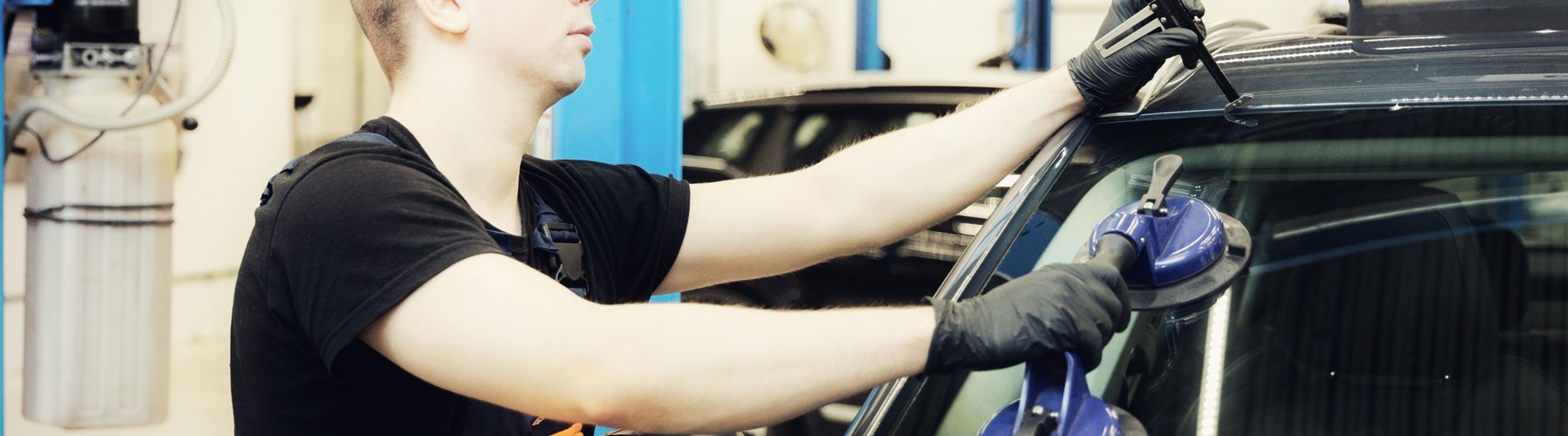 Mechanic repairs windscreen chip